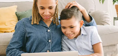 mom and son looking the computer