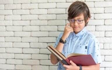 Little boy reading a book